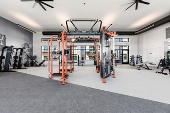 A gym with orange and black equipment